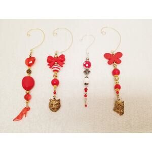 Four red white and gold Christmas icicle ornaments c18